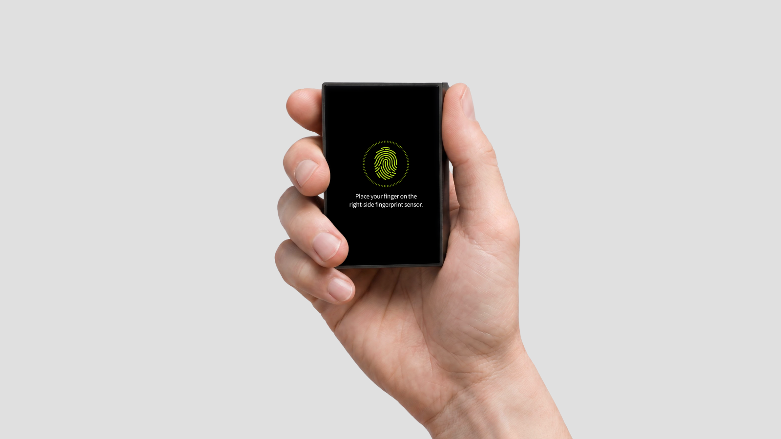 DCENT X held in one hand, authenticated by fingerprint
